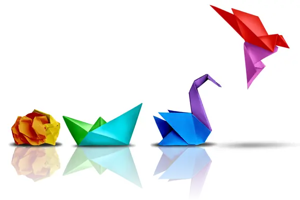 Colourful paper shapes progressing from crumpled paper to an origami bird